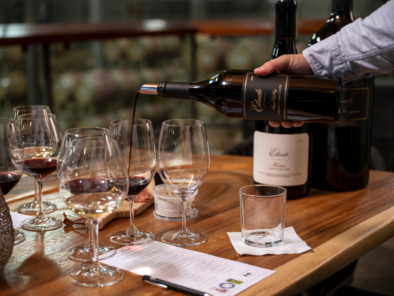 Wine tasting: someone pouring Etude Napa Valley Cabernet into a glass