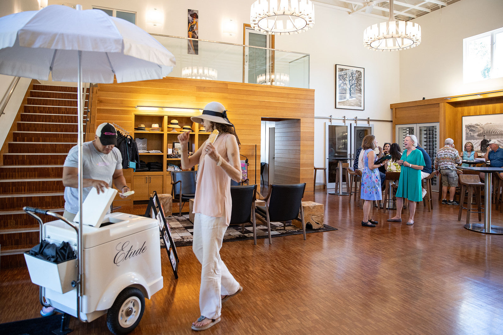 People enjoying popsicles at Etude tasting room.